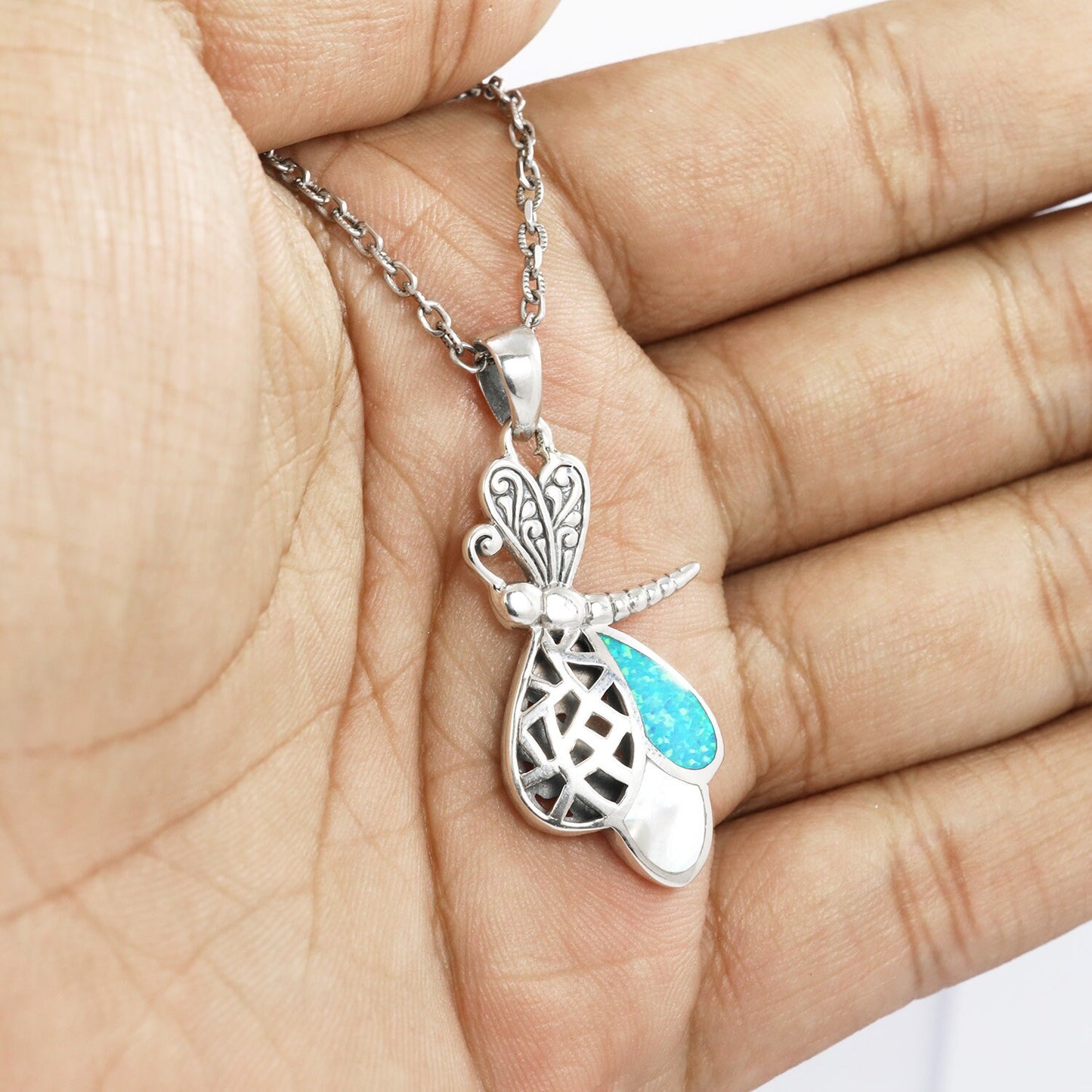 925 sterling silver dragonfly pendant with filigree ornament, created blue opal and genuine white shell