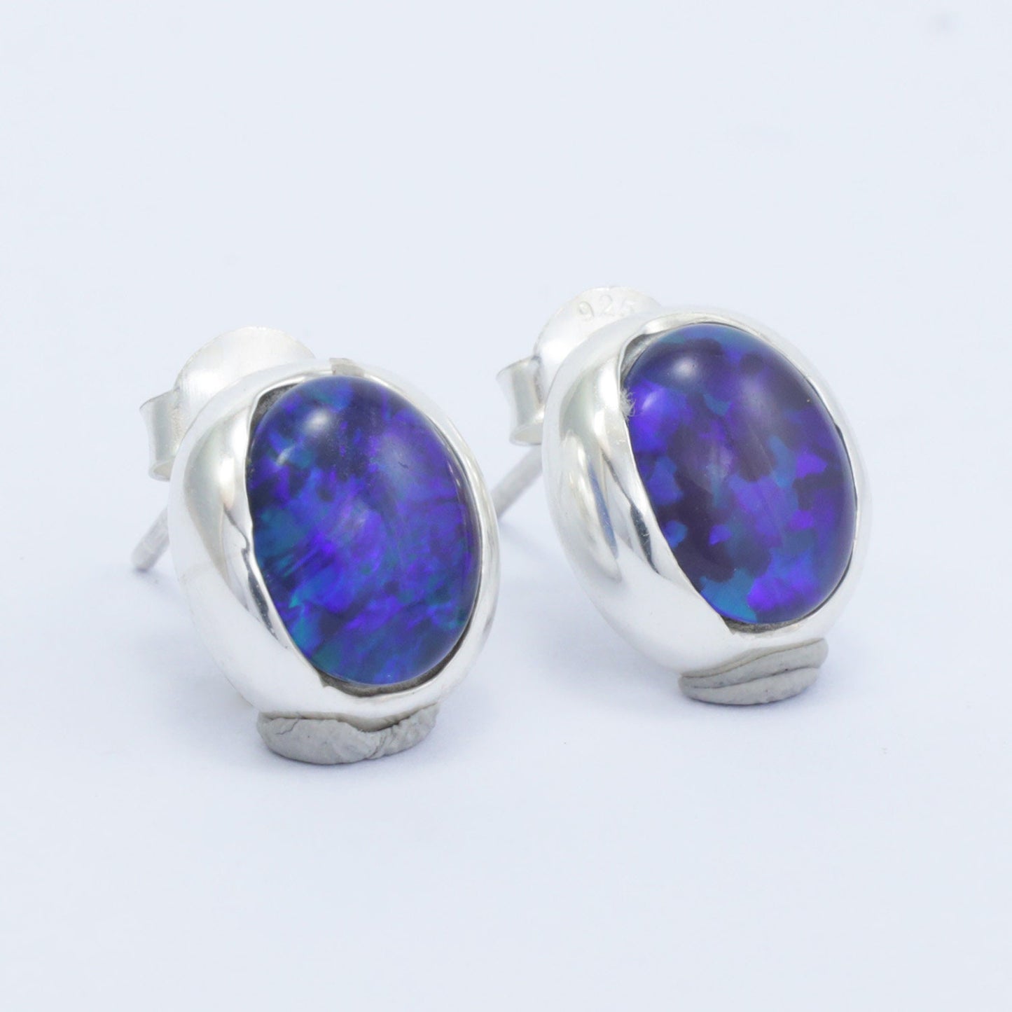 blue opal stud earrings set in 925 sterling silver 8*10 mm oval shape
