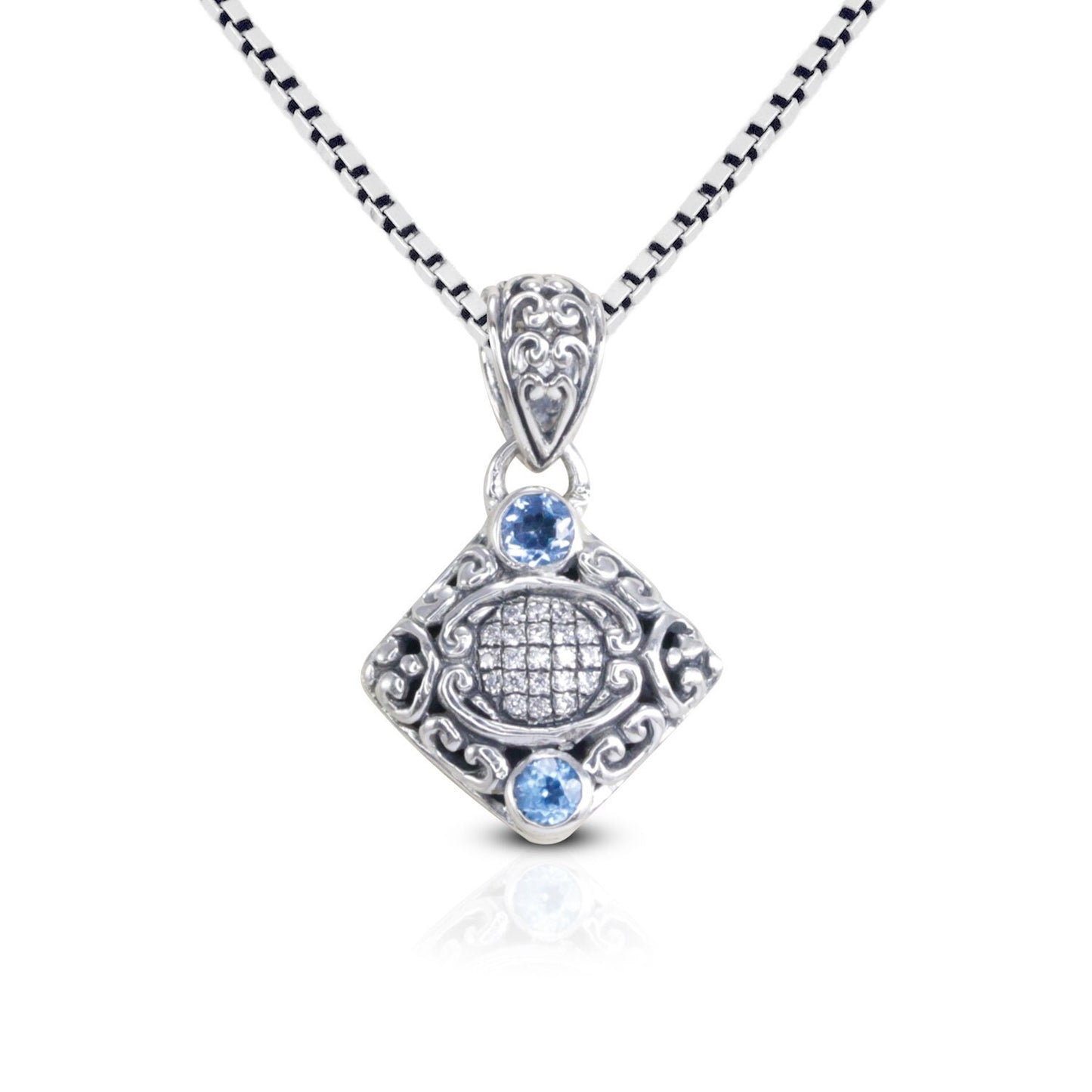 925 sterling silver pendant decorated with Bali inspired ornament and genuine blue topaz