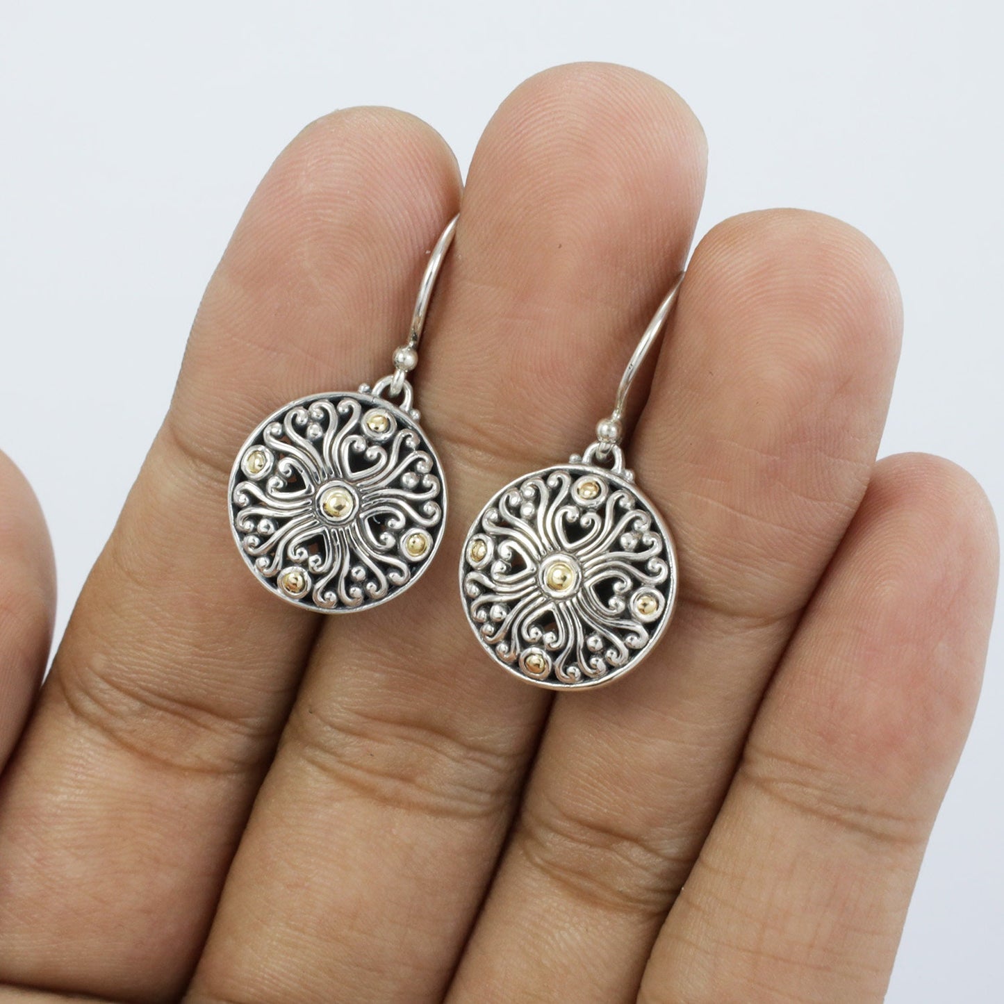 a beautiful filigree earrings 925 sterling silver with 18K yellow gold and antique finishing
