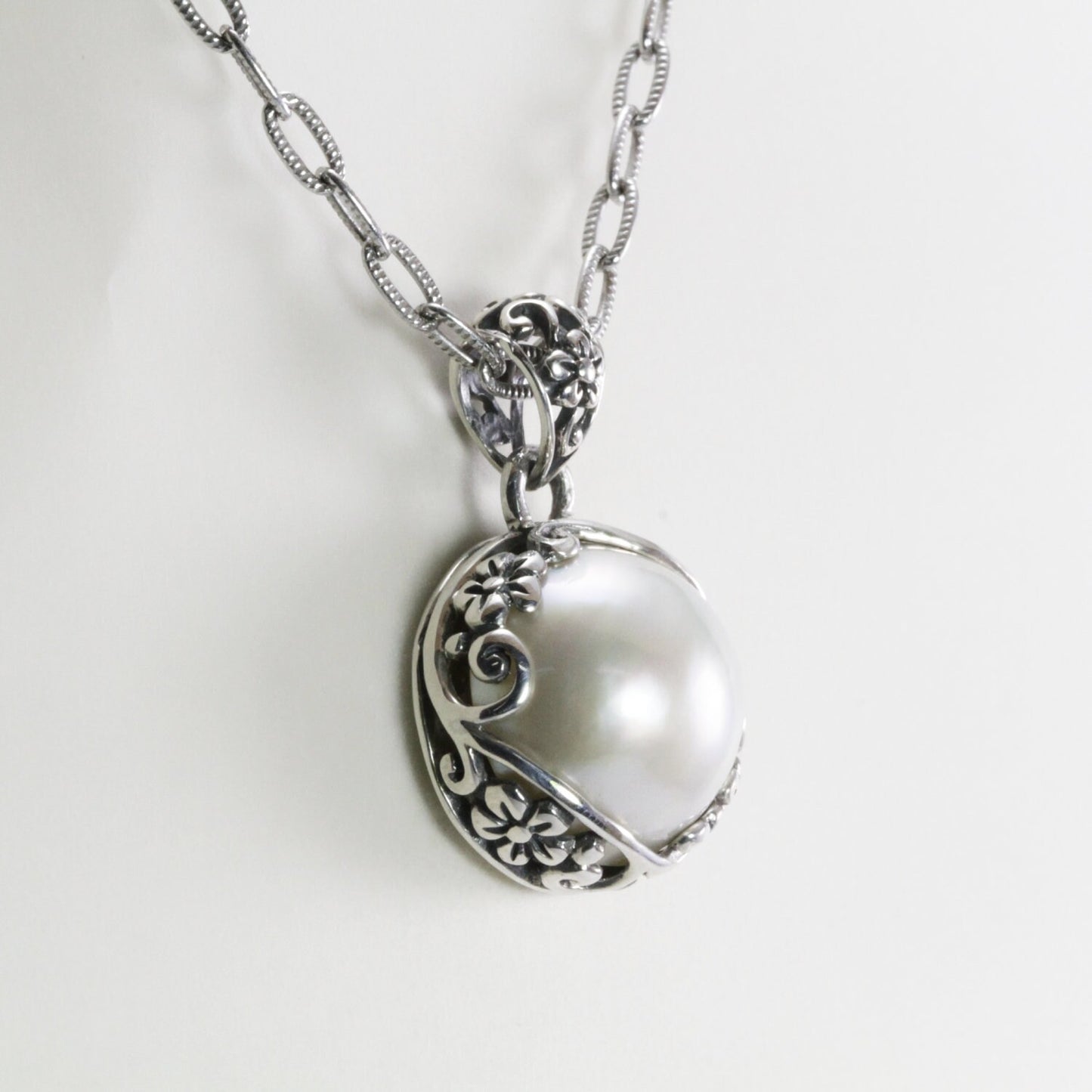 mabe pearl pendant with beautiful  floral art edge in 925 sterling silver