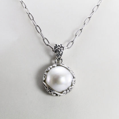 mabe pearl pendant with beautiful  floral art edge in 925 sterling silver