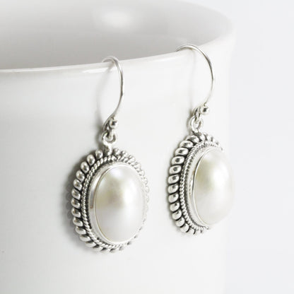 Beautiful dangle drop oval 10*14 mm mabe pearl earrings set in bezel handmade woven cable edge 925 sterling silver, oval pearl earrings