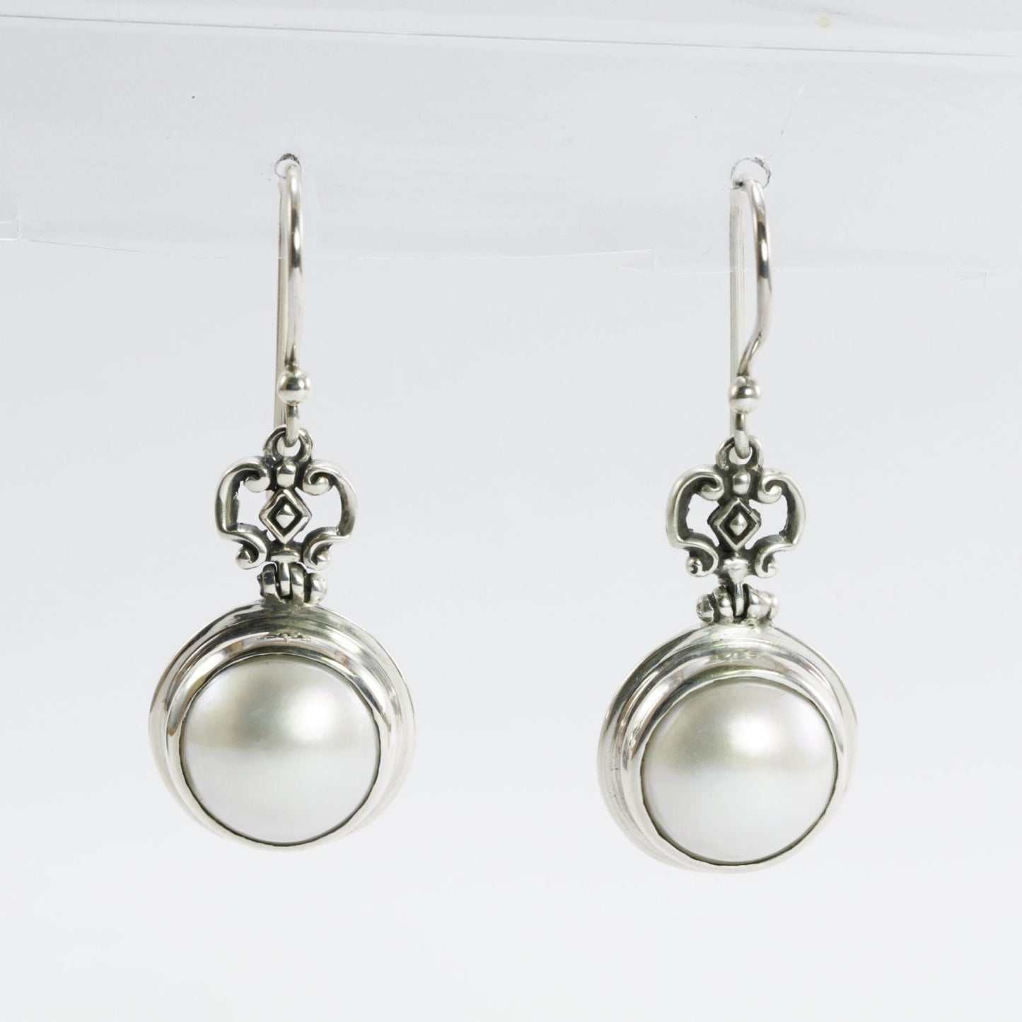 Beautiful white mabe pearl dangle drop earrings set in handmade 925 Sterling silver decorated with filigree crown