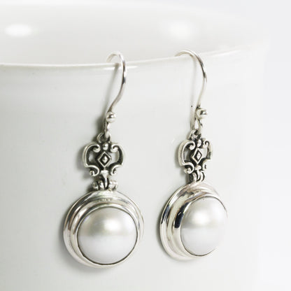 Beautiful white mabe pearl dangle drop earrings set in handmade 925 Sterling silver decorated with filigree crown