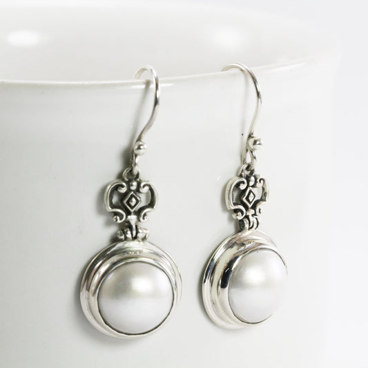 Beautiful white mabe pearl dangle drop earrings set in handmade 925 Sterling silver decorated with filigree crown