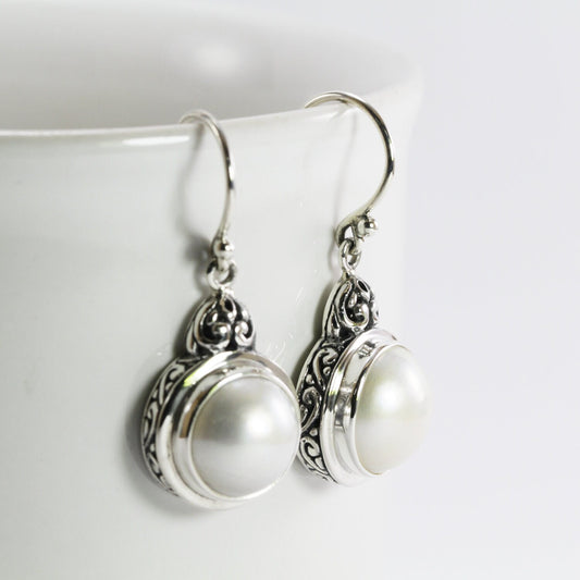 mabe pearl earrings set in 925 sterling silver decorated with filigree ornament
