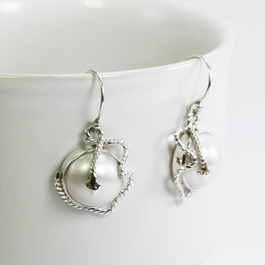 white mabe pearl earrings set in 925 sterling silver with realistic snake carving, snake earrings with pearl