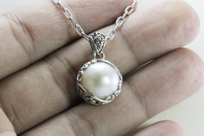 mabe pearl pendant with beautiful  floral art edge in 925 sterling silver