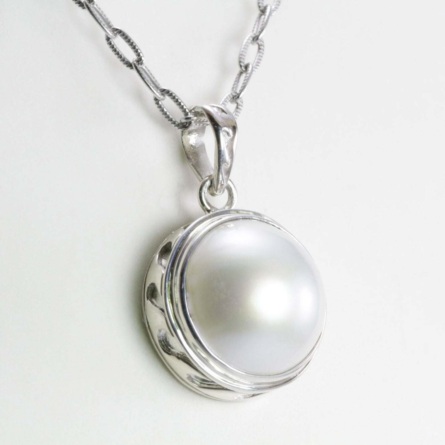 Genuine round 15 MM white Mabe pearl set in 925 sterling silver pendant bezel set decorated with sea wave art carving