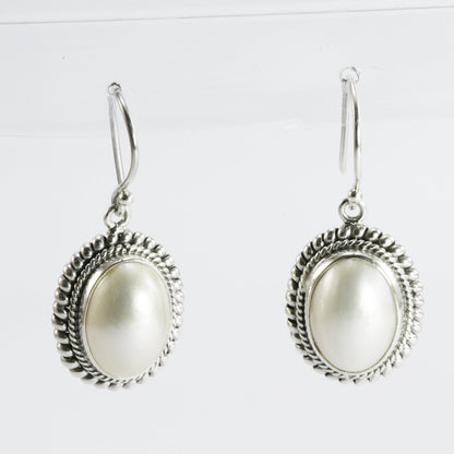 Beautiful dangle drop oval 10*14 mm mabe pearl earrings set in bezel handmade woven cable edge 925 sterling silver, oval pearl earrings