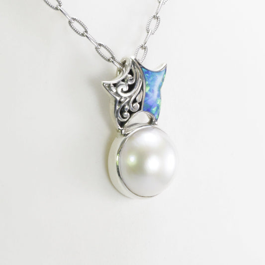 Beautiful starfish pendant with genuine 14 mm round white mabe pearl with blue opal set in 925 sterling silver decorated with swirl filigree
