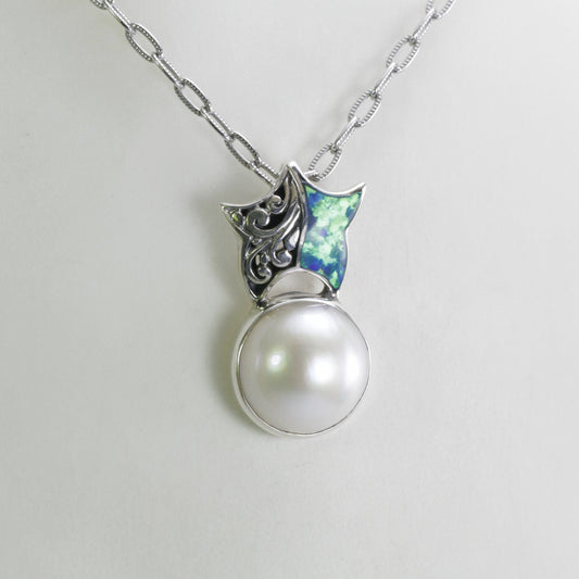 Beautiful starfish pendant with genuine 14 mm round white mabe pearl with blue opal set in 925 sterling silver decorated with swirl filigree