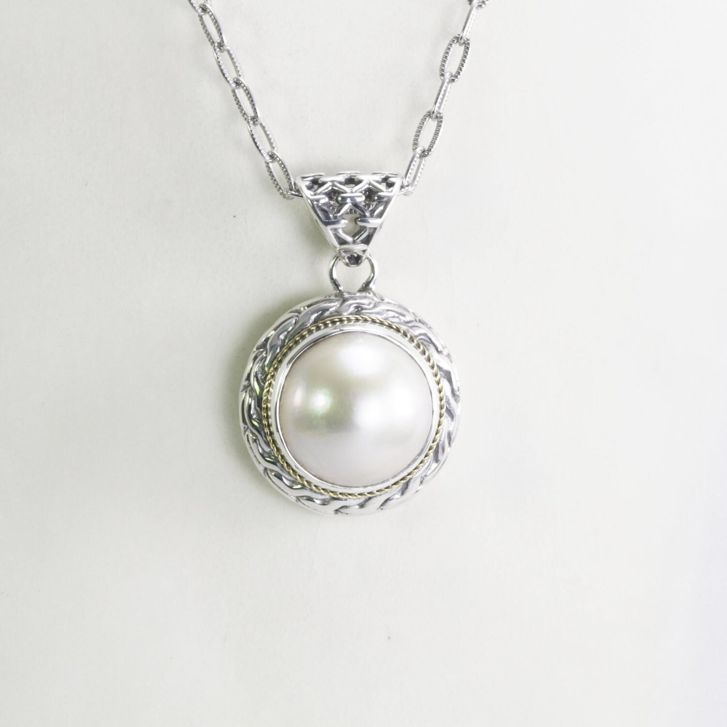 Mabe pearl pendant set in 925 sterling silver decorated with 18K Real gold cable style