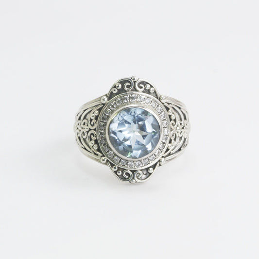 blue topaz ring set in 925 sterling silver decorated with white topaz and ornament filigree