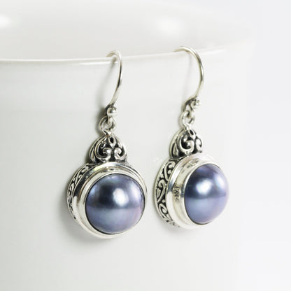 mabe pearl earrings set in 925 sterling silver decorated with filigree ornament
