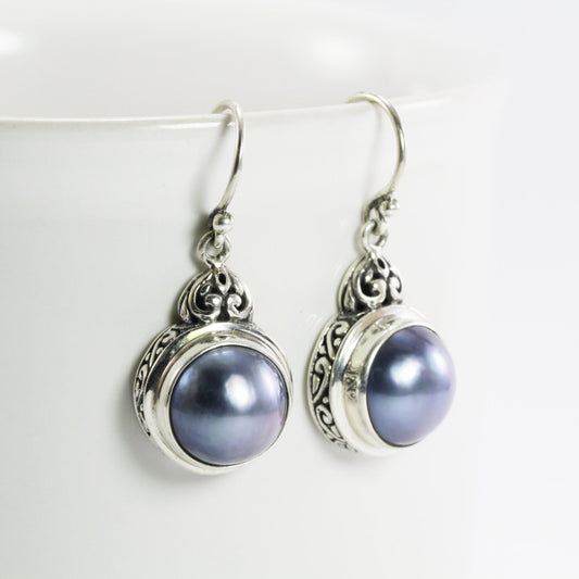 mabe pearl earrings set in 925 sterling silver decorated with filigree ornament