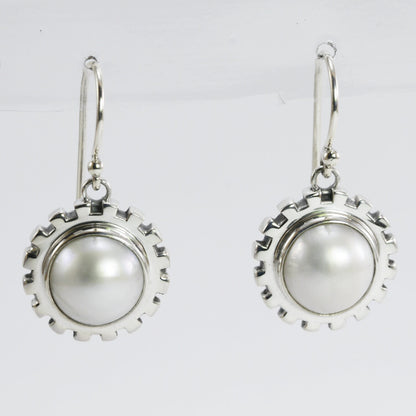 white mabe pearl earrings set in 925 sterling silver decorated with gear style ornament