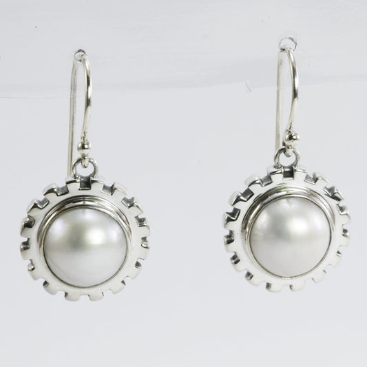 white mabe pearl earrings set in 925 sterling silver decorated with gear style ornament
