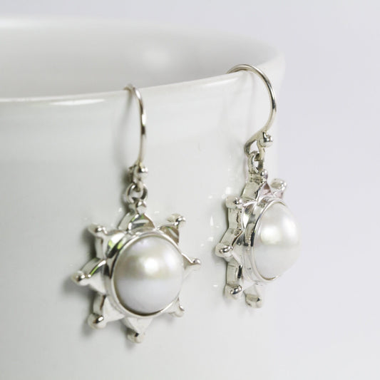 white mabe pearl earrings set in 925 sterling silver with star shape ornament