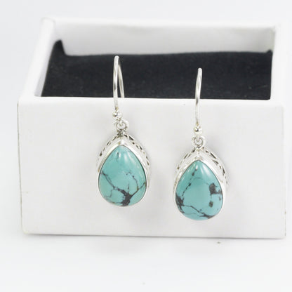 Teardrop Turquoise Dangling Earrings set in 925 Sterling Silver Decorated with filigree handmade bezel