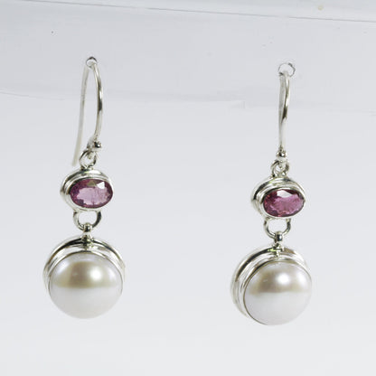 freshwater pearl earrings set in 925 sterling silver with genuine blue topaz