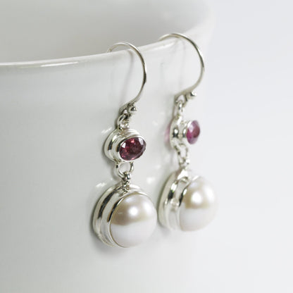 freshwater pearl earrings set in 925 sterling silver with genuine blue topaz