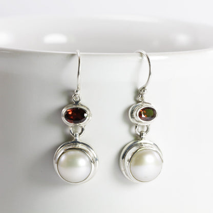freshwater pearl earrings set in 925 sterling silver with genuine blue topaz