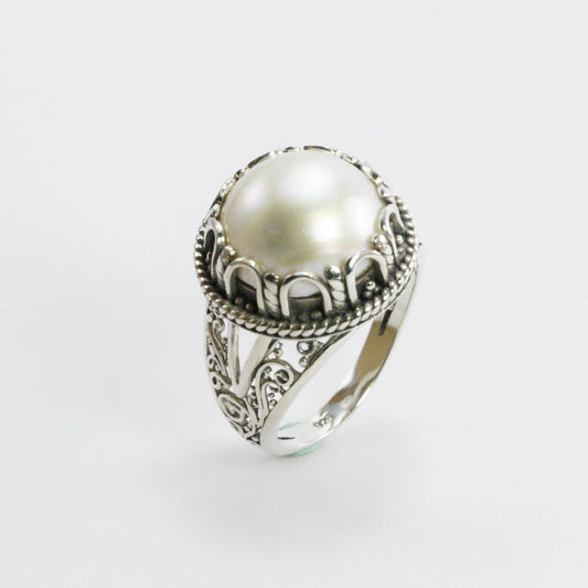 white mabe pearl ring set in 925 sterling silver decorated with Handmade filigree ornament art