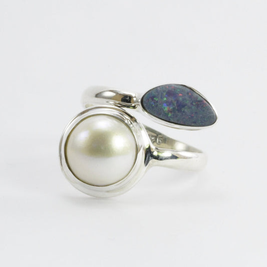 bypass ring with genuine blue opal and round white mabe pearl set in 925 sterling silver,