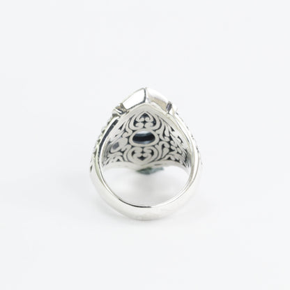 Wide band ring for women with round blue topaz set in 925 sterling silver decorated with filigree carving