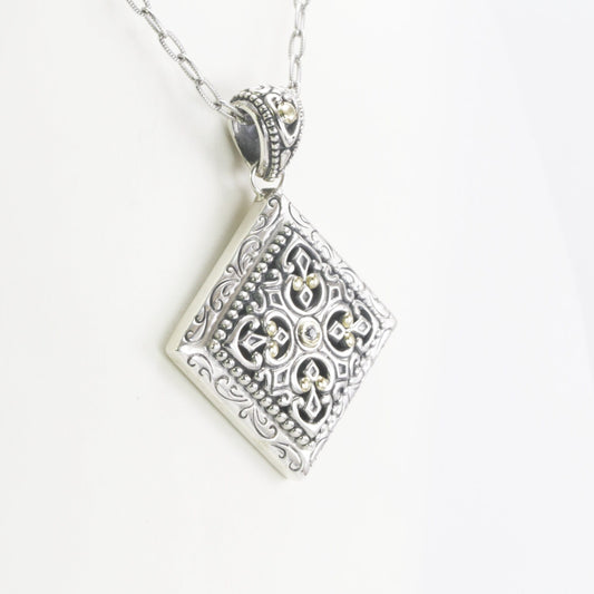 Square pendant 925 sterling silver decorated with Byzantine art ornament, 18K yellow gold accent and white topaz