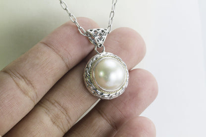 Mabe pearl pendant set in 925 sterling silver decorated with 18K Real gold cable style