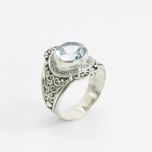 blue topaz ring set in 925 sterling silver decorated with white topaz and ornament filigree