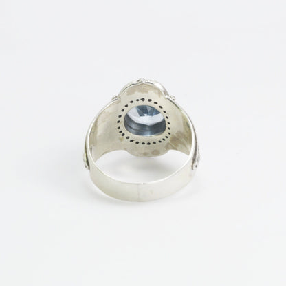 blue topaz ring set in 925 sterling silver decorated with white topaz and ornament filigree