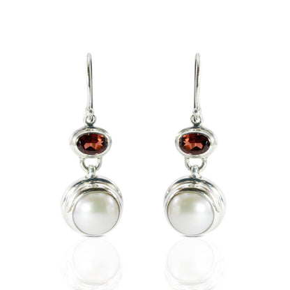freshwater pearl earrings set in 925 sterling silver with genuine blue topaz