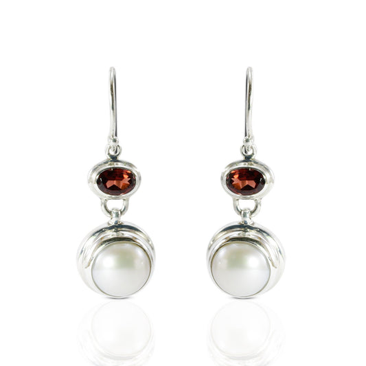 freshwater pearl earrings set in 925 sterling silver with genuine blue topaz