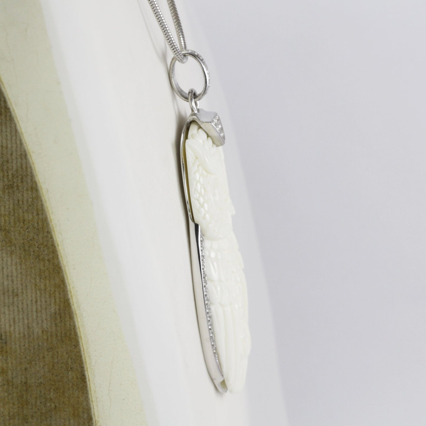 Owl Pendant necklace bone carving decorated with white topaz set in 925 sterling silver