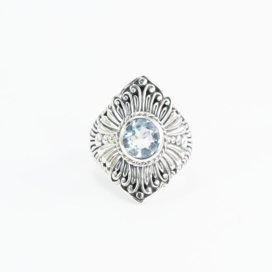Wide band ring for women with round blue topaz set in 925 sterling silver decorated with filigree carving