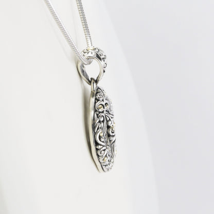infinity pendant with open work filigree ornament in 925 sterling silver and 18k Yellow gold accent,