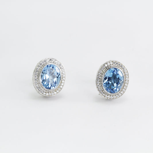 Blue Topaz Stud earrings set in 925 sterling silver decorated with white topaz, oval shape stud earrings