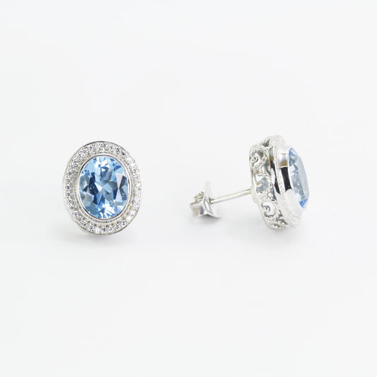 Blue Topaz Stud earrings set in 925 sterling silver decorated with white topaz, oval shape stud earrings