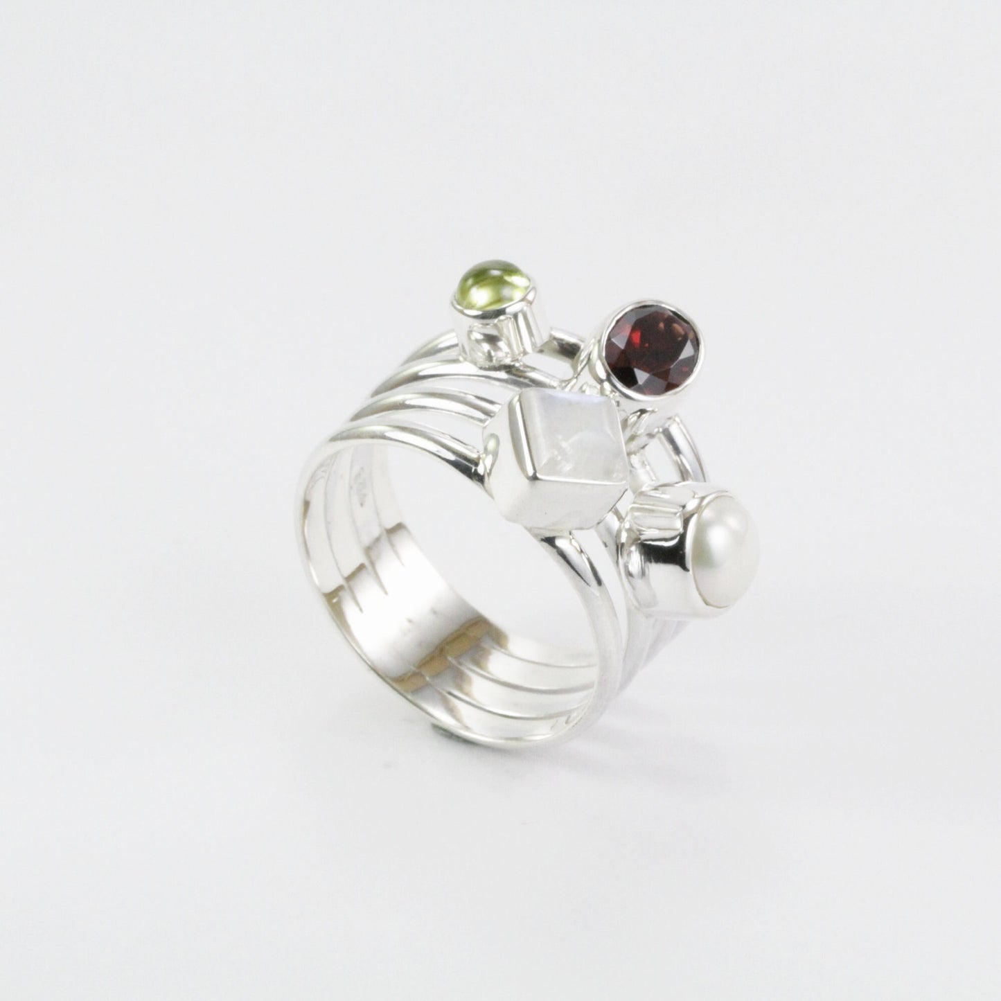 Multi color stone ring with garnet, peridot, moonstone, and fresh water pearl set in 925 sterling silver