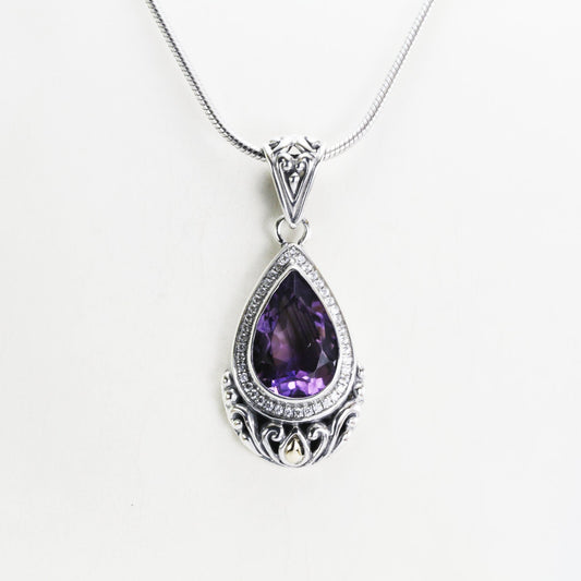 Teardrop amethyst pendant necklace set in 925 sterling silver decorated with 18K yellow gold and white topaz