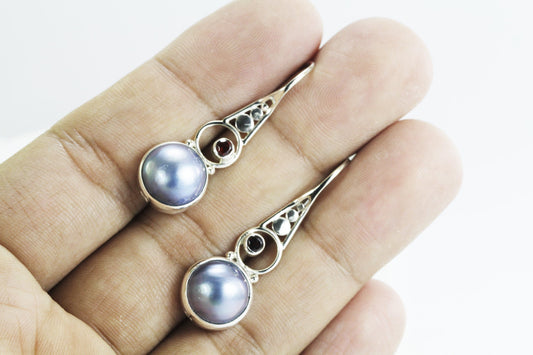 Blue mabe pearl earrings with garnet set in 925 sterling silver decorated with dot style