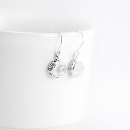 Moonstone earrings set in 925 sterling silver round dangle decorated with filigree edge