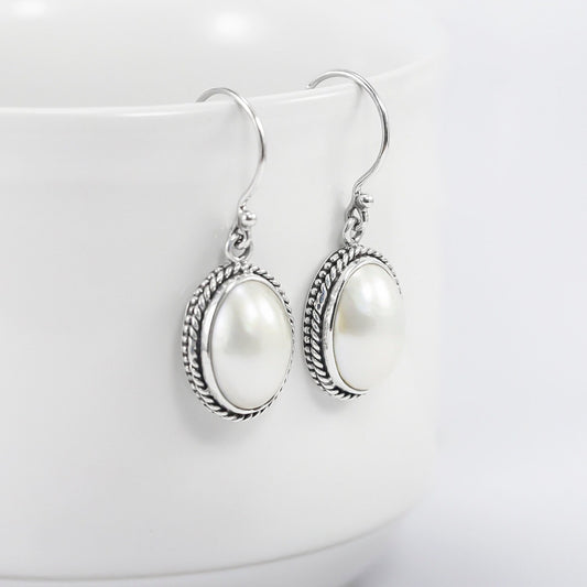 oval  mabe pearl earrings 925 sterling silver decorated with woven chain edge
