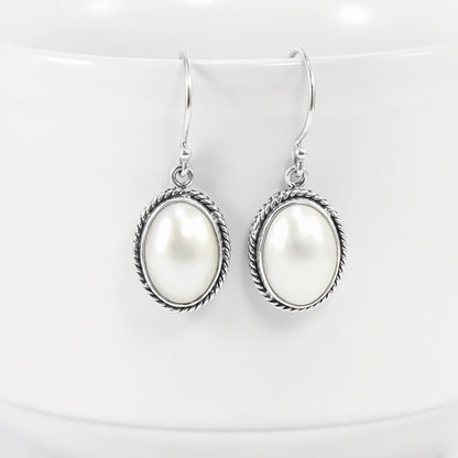 oval  mabe pearl earrings 925 sterling silver decorated with woven chain edge