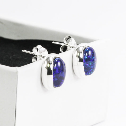 blue fire opal stud earrings set in 925 sterling silver 9*10 mm oval shape