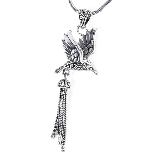 Bird pendant necklace decorated with filigree ornament and chain